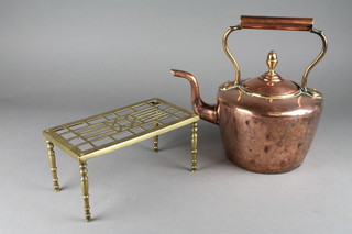 A copper kettle 6" and a rectangular pierced brass footman 10" 