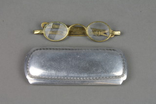 A pair of adjustable brass wig spectacles