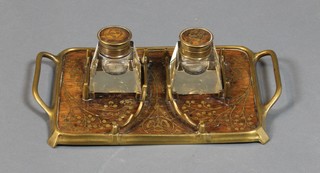 An Art Nouveau rosewood and brass  inkstand with twin handles and 2 waisted square glass inkwells (1 with lid f) and pen rack, inlaid with floral decoration 9 1/2" 
