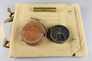 A Short & Mason military issue inclinometer dated 1906 complete with leather case, a military brass gun oil bottle and a webbing map case 