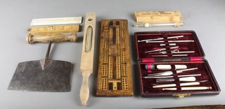 A Hockley Abbey folding 24" gauge, a floating dairy thermometer, a cribbage board and other curios