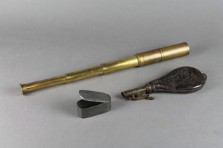 An oval pewter box with hinged lid 1"h x 2 1/2"w, a leather and brass shot flask, and a 3 draw telescope 