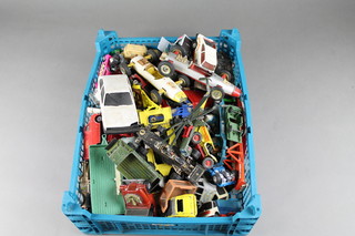 A plastic crate containing a collection of toy cars