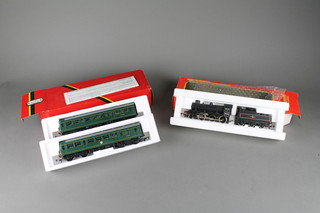 A Hornby OO model locomotive R.857 together with a Hornby OO diesel rail car power coach and trailer coach, both boxed 