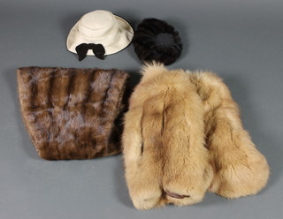 A lady's mink stole, a lady's brown fur cape by the Weald Furriers, a lady's mink hat by Mitzi Lorenz and a stylish white fabric and brown velvet hat 