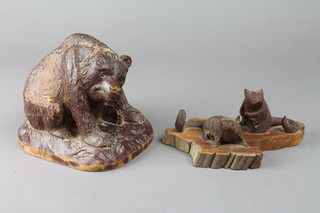 A carved wooden figure of a seated bear 4 1/2" together with other carved figures of seated animals