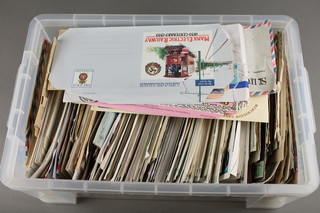 A plastic crate containing a collection of World first day covers
