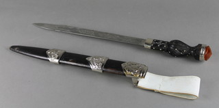 An Indian Dirk with 12" blade, the pommel set a hardstone