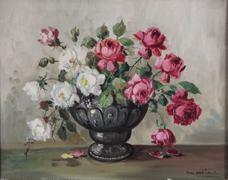 20th Century oil painting.  Still life study of a vase of roses, signed 15" x 19" 
