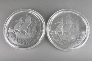 A pair of Lalique clear glass ashtrays decorated with galleons in full sail 7", etched mark