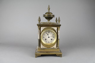 Japy Freres & Co, a French 19th Century 8 day striking mantel clock with silvered dial and Roman numerals, contained in a gilt metal case surmounted by an urn 12" overall