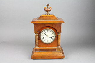 A Victorian walnut clock case with paper dial and Roman numerals surmounted by a lidded urn 17" x 10" x 6" containing a battery operated clock movement 
