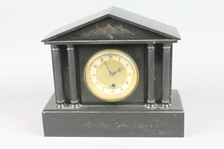 A Victorian black marble mantel clock case of architectural form with paper dial and Arabic numerals containing a battery operated clock 