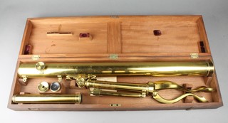 Abraham of Liverpool, a 19th Century brass portable telescope with 2 lenses raised on a tripod base, cased 