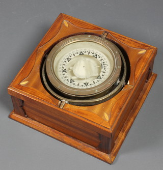 A ships brass 9 1/2" compass, set in a later mahogany box 13"