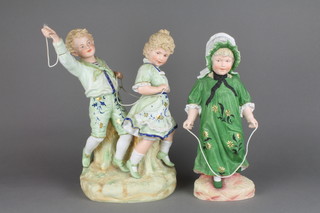 A 19th Century German bisque figure of a girl with skipping rope 14" and a ditto group of 2 children at play 14" (f)