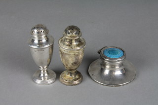 A Victorian silver urn shaped pepperette, 3.5", a similar ditto and an enamelled capstan inkwell (f)