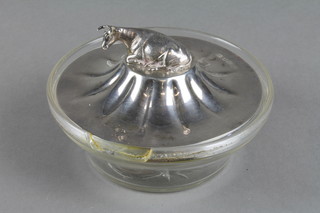 A glass butter dish with a Victorian silver lid, the handle in the form of a reclining cow 5" and 4 silver mounted bottles 