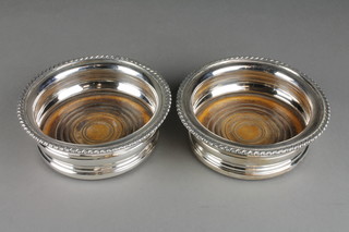 A pair of plated wine coasters with gadroon rims 6" diam.