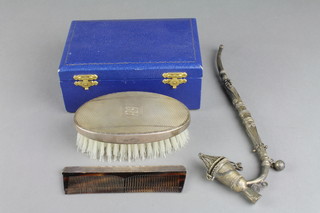 A cased silver backed hair brush and comb, a white metal pipe with filigree decoration