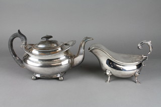 An Edwardian silver plated lidded sauce boat with S scroll handle on hoof feet and a 19th Century plated teapot on ball feet