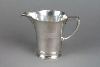 A silver jug with D shaped handle engraved with a monogramme, London 1945 7.5 ozs 