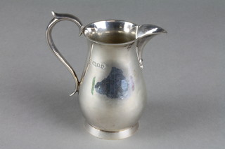 A pear shaped silver cream jug with S scroll handle, London 1945, 5.2 ozs