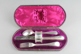 A Victorian silver 3 piece christening set with later napkin ring, contained in a fitted case