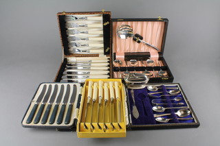 A silver plated cased fish eater set for six, 4 other cased sets and a lighter
