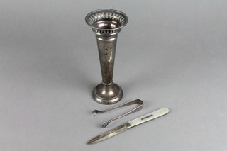 A tapered pierced silver spill vase 6.5", a pair of nips and a silver and mother of pearl fruit knife 