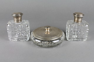 A Sterling silver shallow mounted cut glass bowl and cover and 2 ditto dressing table bottles