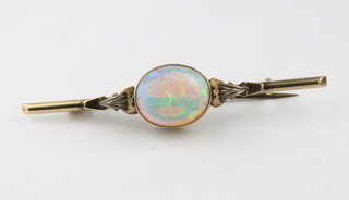 An Edwardian gold bar brooch set with an oval opal, approx 3ct 