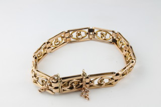 An Edwardian 15ct fancy open link bracelet, approx 17 grams