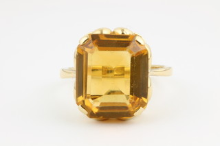 An 18ct scroll mount single stone topaz ring