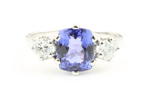 An 18ct white gold tanzanite approx. 2.25ct and 2 stone diamond ring the diamonds approx. 0.55ct 