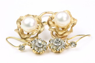 A pair of 9ct gold cultured pearl ear clips in brushed mounts, a 9ct gold paste pair of earrings