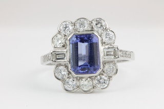 An 18ct white gold tanzanite and diamond cluster ring, the centre stone approx 1.8ct surrounded by approx 1.0ct of diamonds