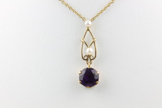 A 9ct seed pearl and amethyst open pendant on a ditto chain