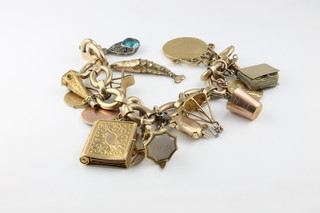 A 9ct gold hollow link charm bracelet with 15 charms including a 1906 sovereign, approx 47 grams 9ct
