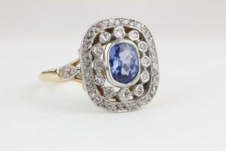 An 18ct yellow gold Art Deco style sapphire and diamond cluster ring, approx 1ct