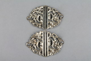 A pair of Edwardian pierced silver scroll buckles