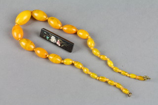 A set of graduated orange coloured "agate" beads 15" and an Italian Pietra dura brooch 