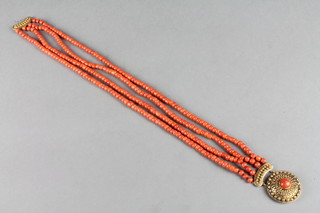 A 19th Century 4 string coral bed necklace with gold etruscan style clasp