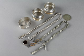 A silver Albert watch chain, 3 silver napkin rings and 2 other items