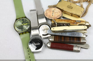 A collection of minor wristwatches, cigarette lighters etc