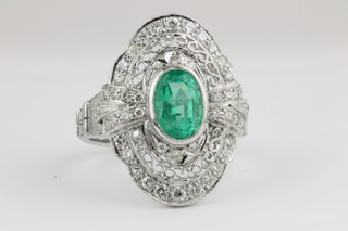 An 18ct white gold Art Deco style emerald and diamond cluster ring 