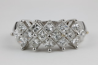 An 18ct white gold 16 stone Princess cut diamond dress ring, approx 2ct