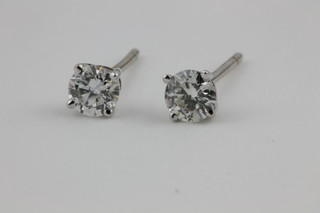 A pair of white gold single stone diamond ear studs