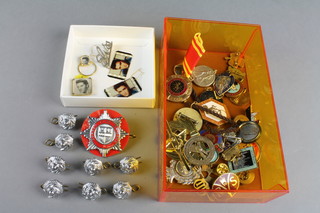 A quantity of lapel badges and pins including Elvis Presley