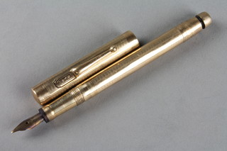 A 9ct gold Swan engine turned fountain pen